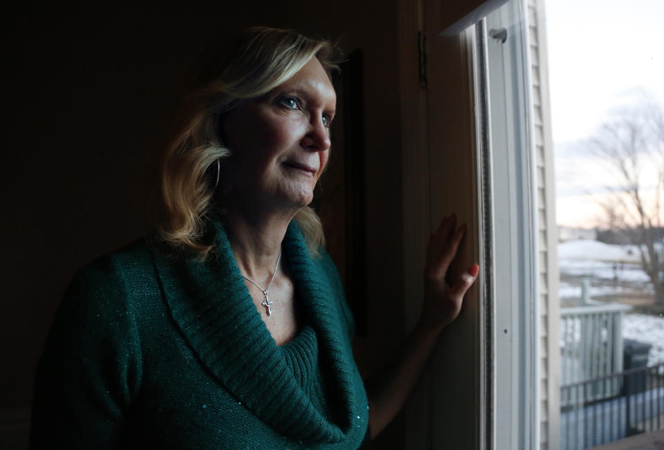 Christine Zuba poses for a portrait at her home in Blackwood, New Jersey, on Monday, Feb. 14, 2022. After coming out as a transgender woman at age 58, Zuba, a lifelong Catholic, was welcomed into Saints Peter and Paul Catholic Church, where she currently serves as a eucharistic minister. (AP Photo/Jessie Wardarski)