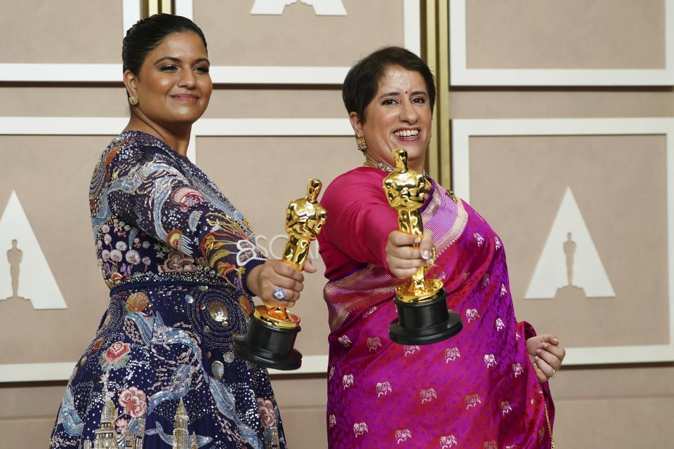 Kartiki Gonsalves, left, and Guneet Monga pose with the award for best documentary short film for "The Elephant Whisperer" in the press room at the Oscars on Sunday, March 12, 2023, at the Dolby Theatre in Los Angeles. (Photo by Jordan Strauss/Invision/AP)