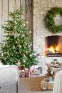 <p>A stone fireplace keeps an elegant Christmas tree toasty on the covered patio at one Arizona home. </p><p><a class="link " href="https://www.amazon.com/Kurt-Adler-Wooden-Snowflake-Ornament/dp/B00EEQCK3Q/ref=sr_1_2?dchild=1&keywords=wooden+starburst+ornaments&qid=1603207845&s=home-garden&sr=1-2&tag=syn-yahoo-20&ascsubtag=%5Bartid%7C10050.g.1251%5Bsrc%7Cyahoo-us" rel="nofollow noopener" target="_blank" data-ylk="slk:SHOP WOOD ORNAMENTS;elm:context_link;itc:0;sec:content-canvas">SHOP WOOD ORNAMENTS</a></p>