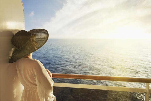 Woman looking out to sea on a cruise ship