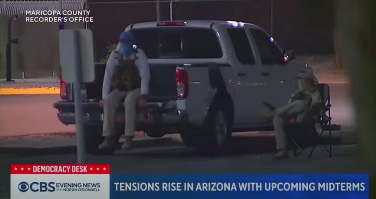 Arizona election officials released this image as one example of armed people watching ballot drop boxes. <a href="https://www.youtube.com/watch?v=ItGCRaEN69o" rel="nofollow noopener" target="_blank" data-ylk="slk:Maricopa County Recorder's Office via CBS News;elm:context_link;itc:0;sec:content-canvas" class="link ">Maricopa County Recorder's Office via CBS News</a>