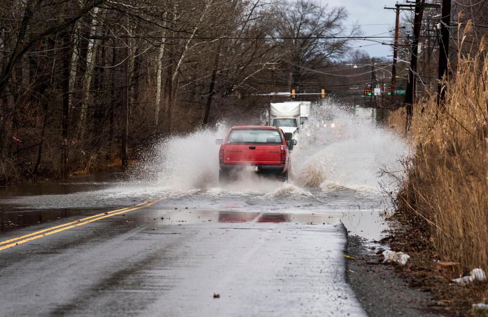 Drivers go through the standing flood water on State Rd. caused by the recent rain storm in Bensalem on Monday, Dec. 18, 2023.

Daniella Heminghaus | Bucks County Courier Times