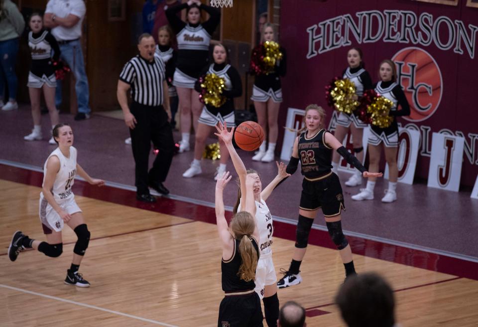 Webster County's Karsyn Cates (4) is fouled on a 3-point attempt by Henderson County's Careese Toombs (31) during their game at Henderson County High School Tuesday night, Feb. 8, 2022. Henderson County held a one point lead with a half-second left on the clock when Cates, a freshman with only one other free throw attempt on the season, had to step to the line for three free throws. She missed all three and Henderson won the game 45-44.