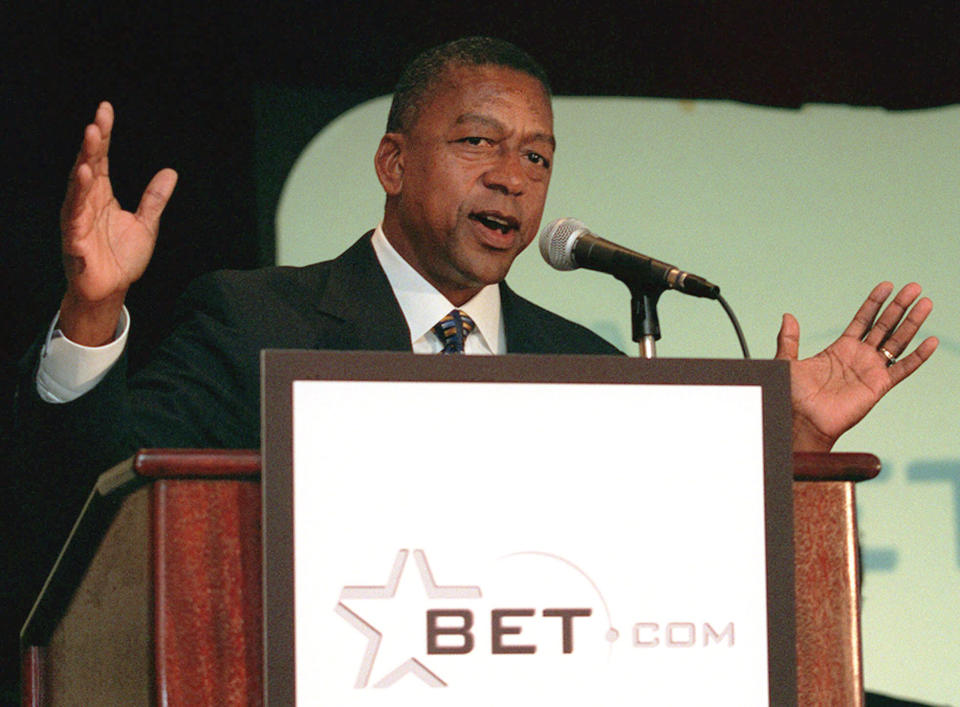 FILE - Black Entertainment Television chairman and founder, Robert Johnson, gestures during a press conference in New York on Aug. 12, 1999. Johnson built the brand into the leading TV network for Black Americans. BET’s decision to embrace hip-hop literally paid off: Johnson and his then-wife, Sheila, sold the network to Viacom in 2000 for $3 billion — which made them the nation’s first Black billionaires. He remained CEO until 2006. (AP Photo/Diane Bondareff, File)