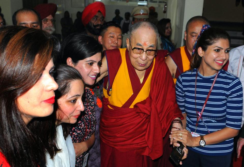 The Dalai Lama with students in India. <a href="https://www.gettyimages.com/detail/news-photo/the-dalai-lama-interacts-with-people-at-chandigarh-news-photo/1176011239?adppopup=true" rel="nofollow noopener" target="_blank" data-ylk="slk:Keshav Singh/Hindustan Times via Getty Images;elm:context_link;itc:0;sec:content-canvas" class="link ">Keshav Singh/Hindustan Times via Getty Images</a>