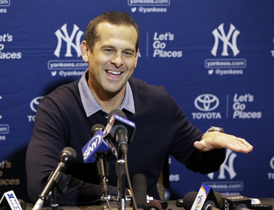 Aaron Boone, manager of the New York Yankees, talks with members of the media at the MLB baseball winter meetings Tuesday, Dec. 12, 2017, in Orlando, Fla. (AP Photo/John Raoux)