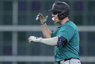 Seattle Mariners designated hitter Mitch Garver celebrates after hitting an RBI double during the fourth inning of a baseball game against the Houston Astros, Saturday, May 4, 2024, in Houston. (AP Photo/Kevin M. Cox)