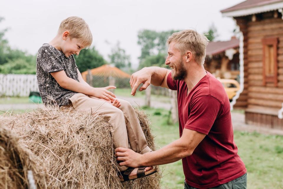 father and son spend time together in the village