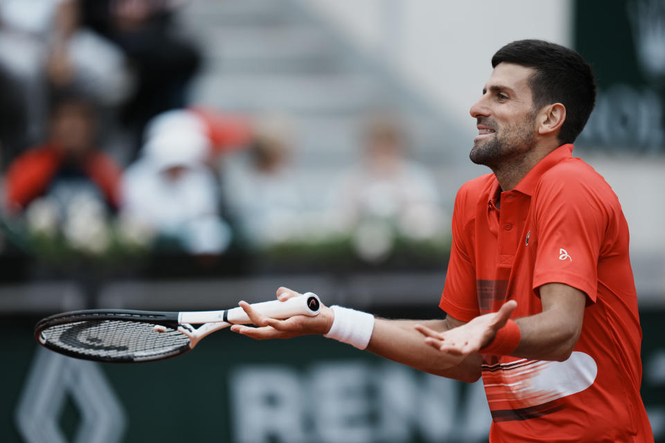 Serbia's Novak Djokovic reacts as he plays Slovakia's Alex Molcan during their second round match of the French Open tennis tournament at the Roland Garros stadium Wednesday, May 25, 2022 in Paris. (AP Photo/Thibault Camus)