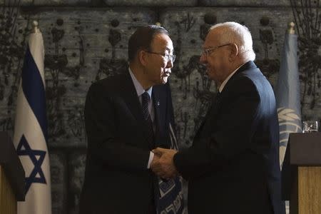 Israeli President Reuven Rivlin (R) shake hands with United Nations Secretary-General Ban Ki-moon (L) after their meeting in Jerusalem October 20, 2015. REUTERS/Nir Elias