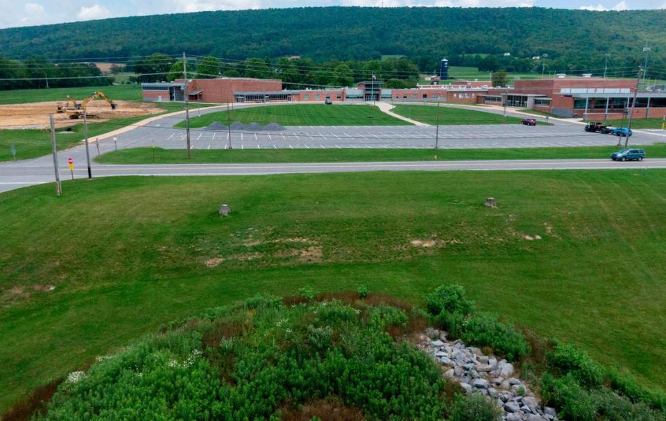 A new pedestrian crosswalk with safety lights will be installed to cross Route 45 between the Penns Valley Area High School and the Penns Valley Elementary & Intermediate School. Traffic moves along Route 45 as work on the new parking area is underway on Thursday, July 6, 2023.