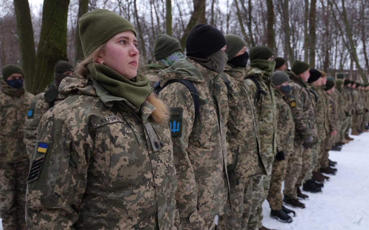 Civilians, including Tatiana (left), 21, a university veterinary medicine student who is also enrolled in a military reserve program, participate in a Kyiv Territorial Defence unit training - Sean Gallup/Getty Images