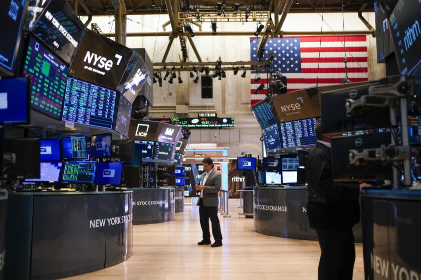 FILE - Traders work on the floor at the New York Stock Exchange in New York, Aug. 10, 2022. Stocks slipped in morning trading on Wall Street Wednesday, Oct. 26, 2022 and big technology stocks were the heavy weights on major indexes following several weak earnings reports and financial forecasts. The S&P 500 fell 0.4, despite more stocks gaining ground than falling in the benchmark index. The tech-heavy Nasdaq slipped 1.5%. The Dow Jones Industrial Average gained ground. Alphabet and Microsoft each slumped after reporting disappointing results. (AP Photo/Seth Wenig, file)