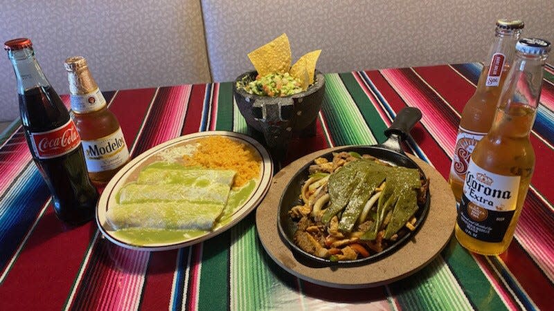 Enchiladas with rice, beans on a cheese and tomato green sauce with fajitas and nachos with pico de gallo from El Jarocho in Rome.