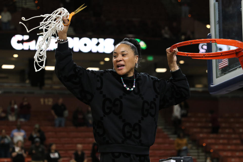 GREENVILLE, SC - MARCH 10: South Carolina Gamecocks head coach Dawn Staley finishes cutting down the net during the SEC Women's Basketball Tournament Championship Game between the LSU Tigers and the South Carolina Gamecocks March 10, 2024 at Bon Secours Wellness Arena in Greenville, S.C. (Photo by John Byrum/Icon Sportswire via Getty Images)