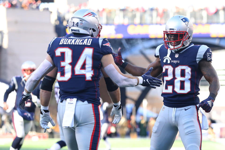 On Sunday, Patriots running back James White, right, tied the NFL postseason record for receptions in a game with 15. (Getty Images)