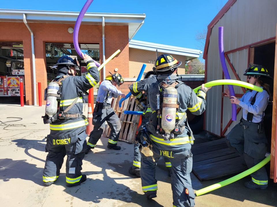 Hendersonville firefighters pretend they are fighting a fire with pool noodles in an April Fool's social media post on April 1, 2023. The post was the idea of Brandy Heatherly, who won "Best Use of Humor" at the NC3C communicators conference in Concord.