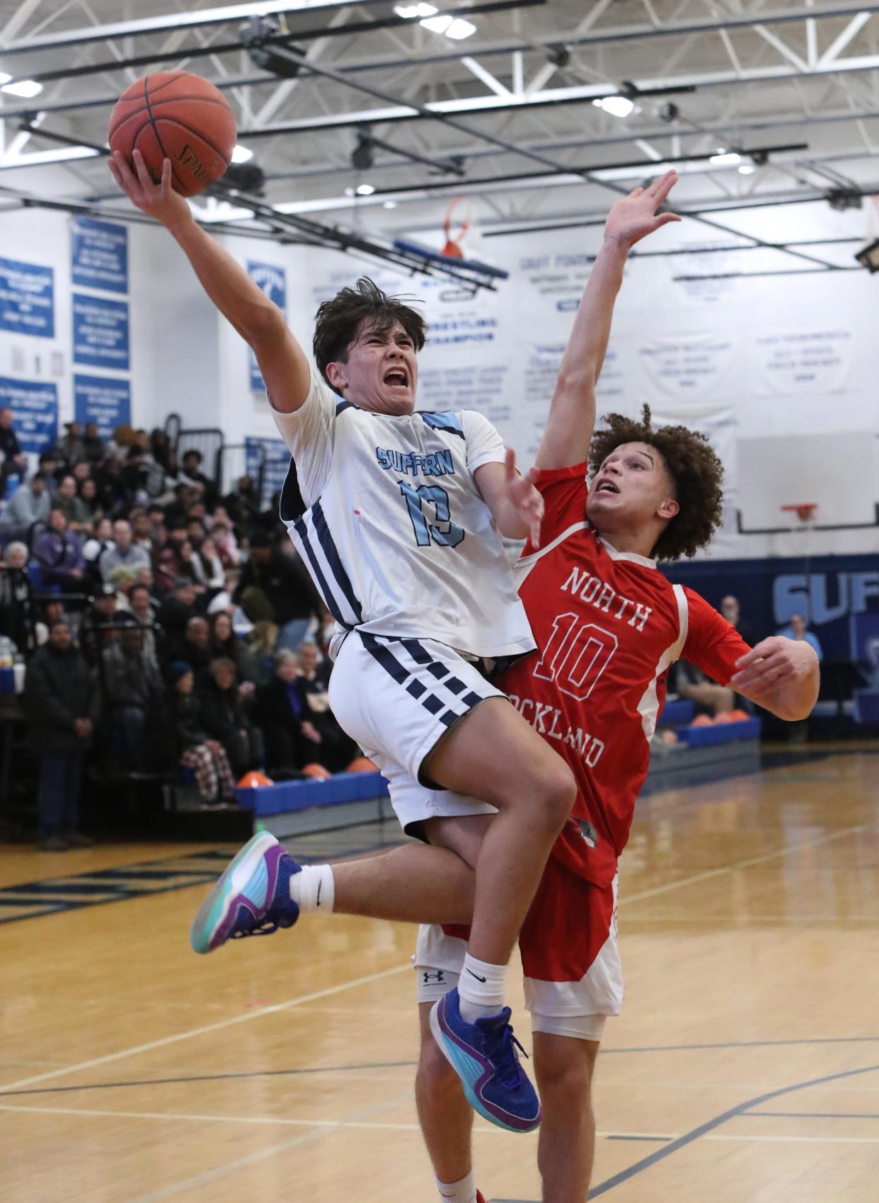 Suffern's Jake Pampolina shoots over North Rockland's Aiden Santiago during their game at at Suffern Feb. 6, 2024. North Rockland won 57-50.