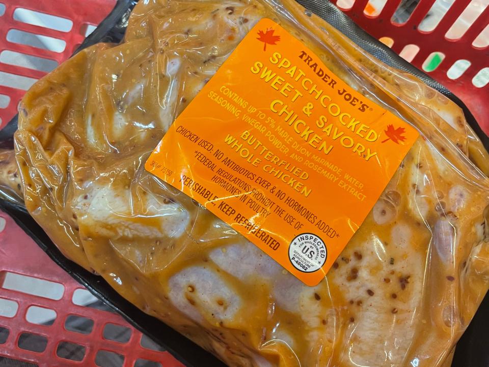 package of sweet and savory chicken from trader joes in a shopping basket