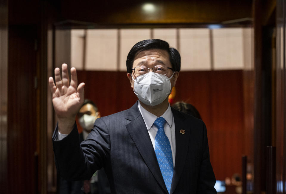 HONG KONG, CHINA - JULY 6: Hong Kong Chief Executive John Lee Ka-chiu (C) leaves after a question and answer session at the Legislative Council main chamber for the first time since he was sworn in as Hong Kong's new chief executive in Hong Kong, China on July 6, 2022. (Photo by Miguel Candela/Anadolu Agency via Getty Images)