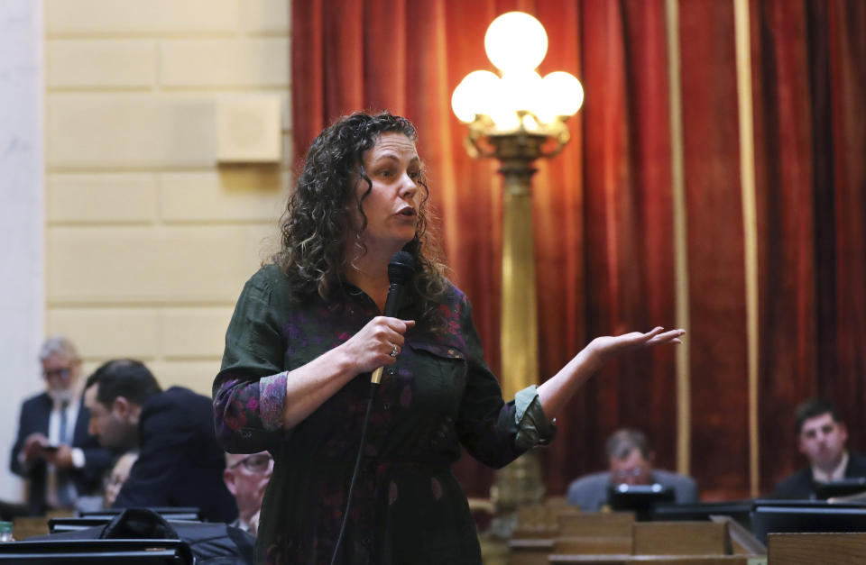 FILE- In this March 12, 2019, file photo Rhode Island Rep. Teresa Tanzi addresses legislators during a late afternoon session on gaming at the State House in Providence, R.I. As lawmakers nationwide decide whether to allow sports betting in their state, they’re debating whether bets, like almost everything else in our lives, can be managed online or whether wagers should be made only in person. (AP Photo/Charles Krupa, File)