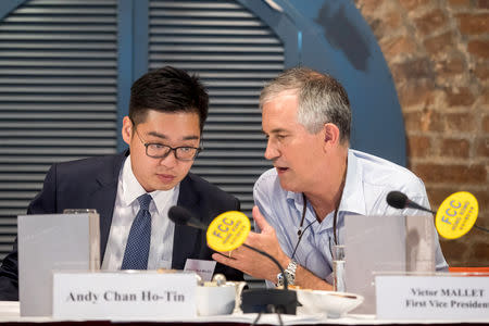 Victor Mallet, Financial Times journalist and first vice president of the Foreign Correspondents' Club (FCC), speaks with Andy Chan, founder of the Hong Kong National Party, during a luncheon at the FCC in Hong Kong, China, August 14, 2018. Picture taken August 14, 2018. Paul Yeung/Pool via REUTERS