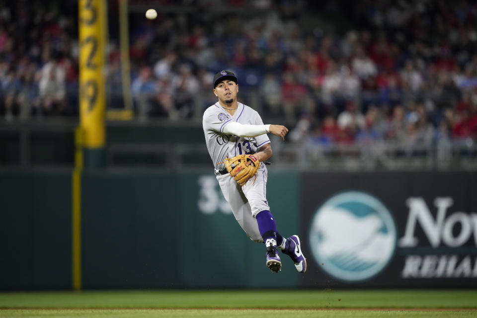 Colorado Rockies shortstop Alan Trejo throws to first base after fielding a ground out by Philadelphia Phillies' Bryson Stott during the sixth inning of a baseball game, Friday, April 21, 2023, in Philadelphia. (AP Photo/Matt Slocum)