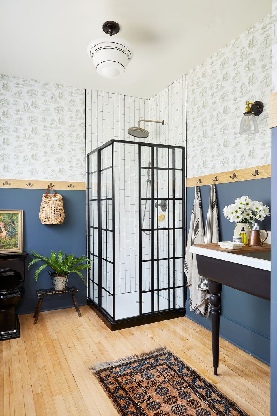 bathroom with shower in corner and tile that goes up to the ceiling