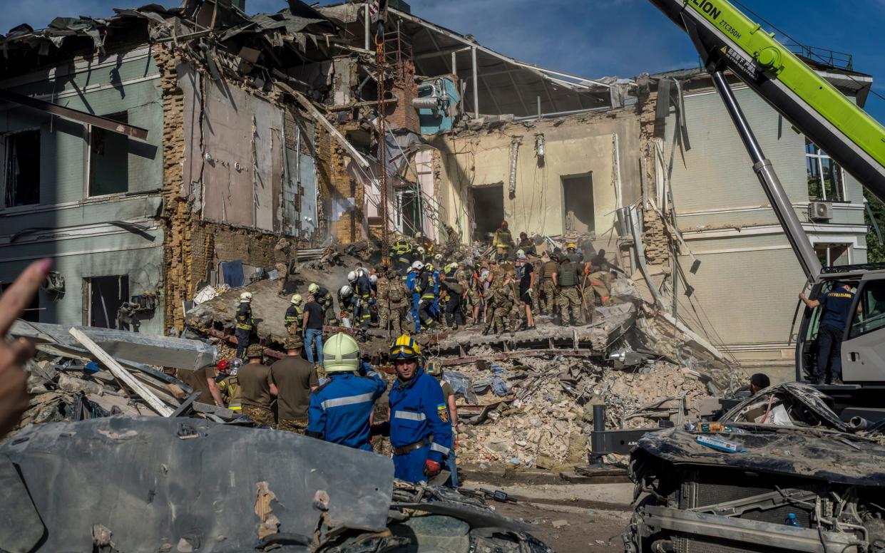 Rescuers work at the hospital after the Russian missile strike