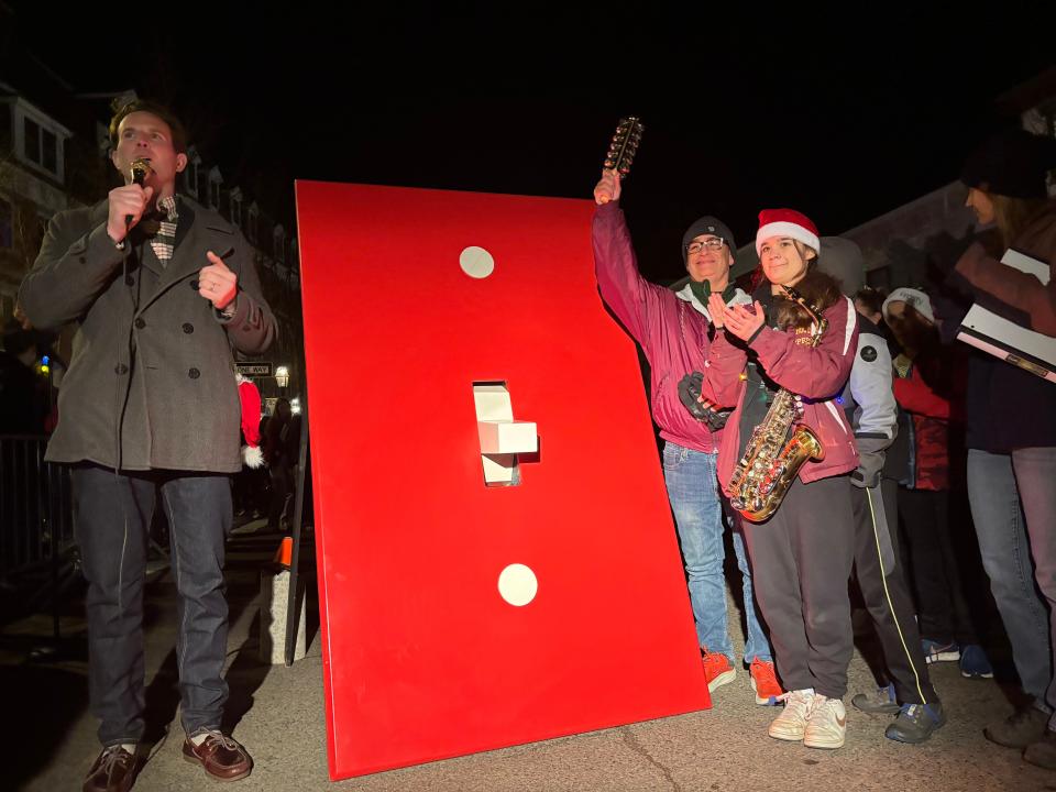 Steve Cirillo, performing arts director for the Portsmouth school district, waves to the crowd before the city's annual holiday tree lighting and parade on Saturday, Dec. 2, 2023. Cirillo was named the grand marshal of the 2023 parade.