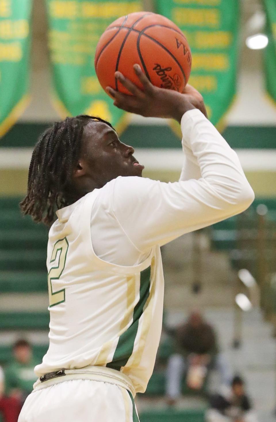 St. Vincent-St. Mary's Jayson James shoot against South Oak Cliff on Wednesday.