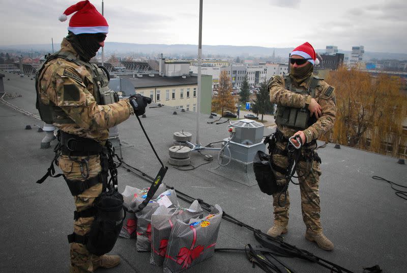 Polish counter-terrorism police officers deliver presents to patients at children's hospital on Saint Nicholas Day