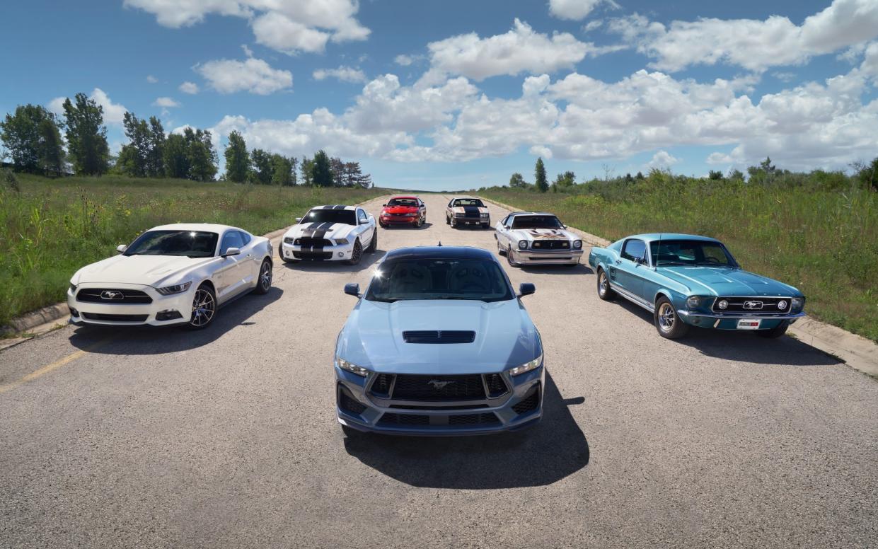 Seven generations of Ford Mustangs, here recreated in a 2024 promotional shot celebrating the car's 60th birthday