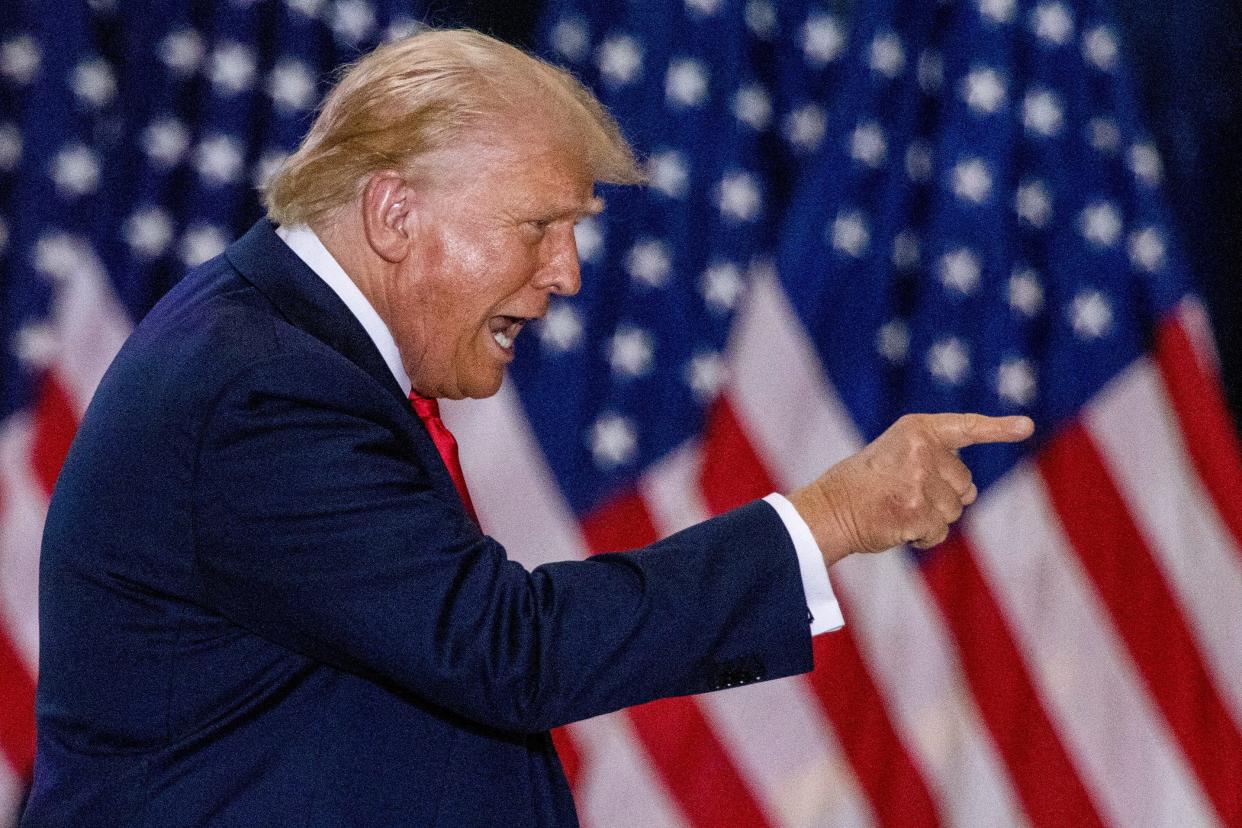 FILE PHOTO: Republican presidential nominee and former U.S. President Donald Trump gestures during a rally with his vice presidential running mate U.S. Senator JD Vance in St. Cloud, Minnesota, U.S., July 27, 2024. REUTERS/Carlos Osorio/File Photo