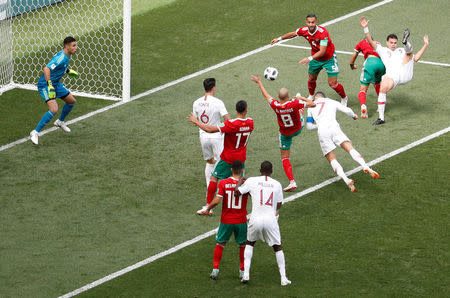 Soccer Football - World Cup - Group B - Portugal vs Morocco - Luzhniki Stadium, Moscow, Russia - June 20, 2018 Portugal's Cristiano Ronaldo scores their first goal REUTERS/Christian Hartmann