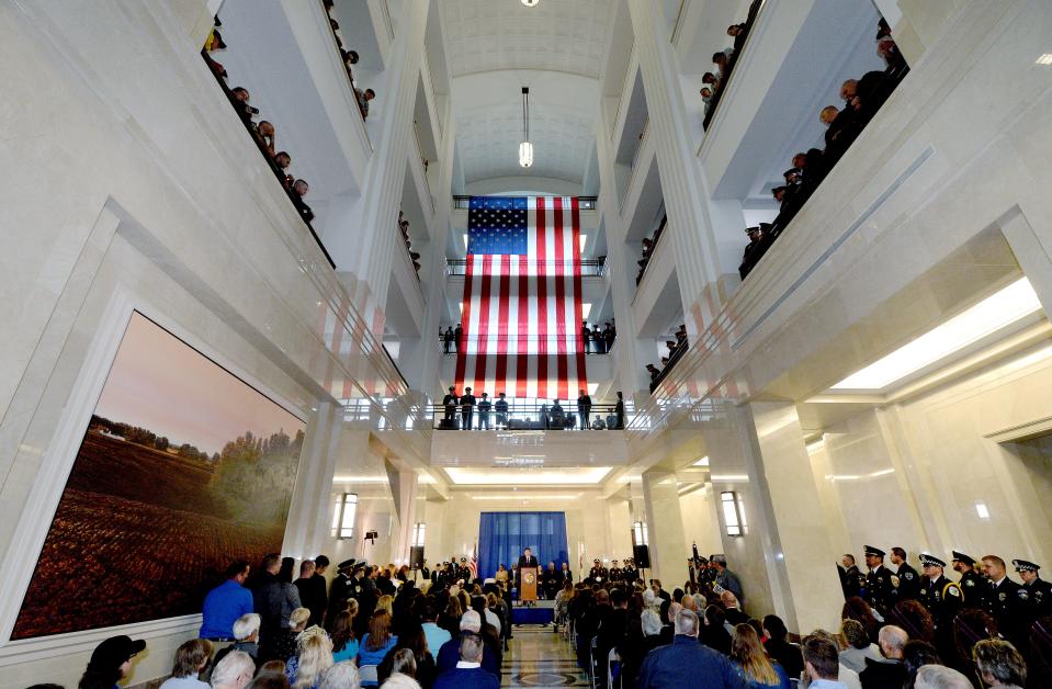 Gov. JB Pritzker speaks Thursday during the a ceremony for fallen police officers at the Illinois State Library. Because of rain, the ceremony was moved from the Illinois Police Officers Memorial to the state library. [Thomas J. Turney/The State Journal-Register]