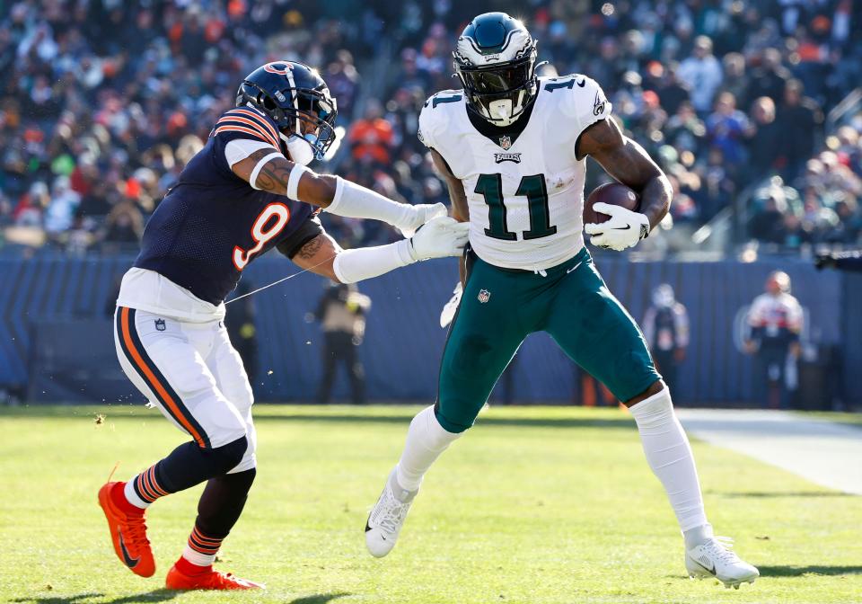 Philadelphia Eagles wide receiver A.J. Brown (11) runs the ball after a catch past Chicago Bears safety Jaquan Brisker (9) during the second quarter.