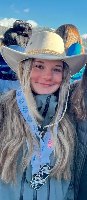 Eden Kruger poses with her medals and the prize cowboy hat after winning the Under-15 mogul skiing title at the U.S. Freestyle Junior Nationals on March 18 in Colorado.