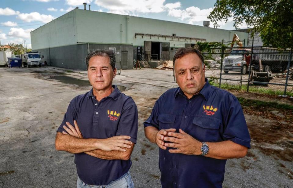 Raul Ortiz de la Renta, left, and Jose Molina, right, owners of Grupo Sur, a commercial bakery in Miami’s Little River neighborhood, were evacuated from their building in 2022 due to a report deeming it unsafe. In a lawsuit, they obtained evidence they allege shows their landlords “conspired” with an engineering firm to illegally evict them as part of a gentrification effort.Ortiz de la Renta and Molina visited the site on Thursday, June 27, 2024.