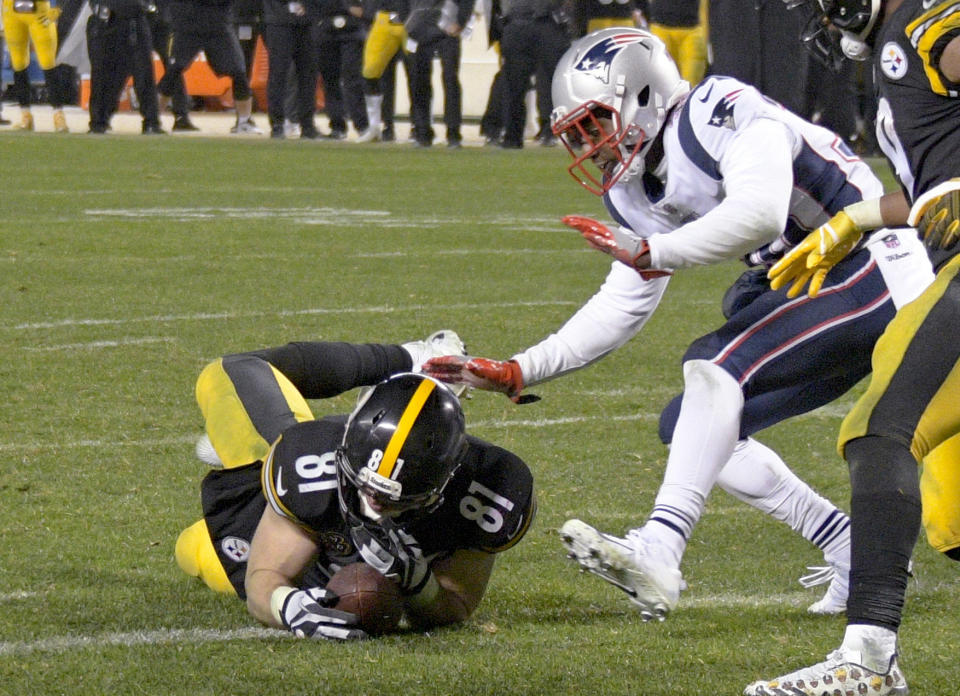 Pittsburgh Steelers tight end Jesse James (81) loses his grip on the football after crossing the goal line on a pass play against the New England Patriots in the closing seconds of the fourth quarter of an NFL football game in December. (AP)