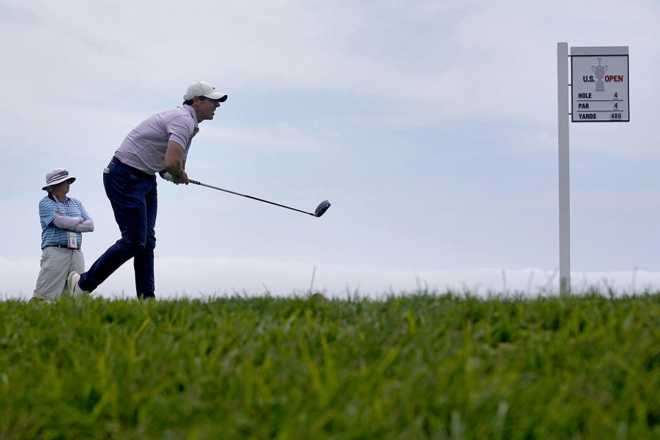 Rory McIlroy, of Northern Ireland, watches his shot from the 14th tee during a practice round of the U.S. Open Golf Championship, Wednesday, June 16, 2021, at Torrey Pines Golf Course in San Diego. (AP Photo/Marcio Jose Sanchez)