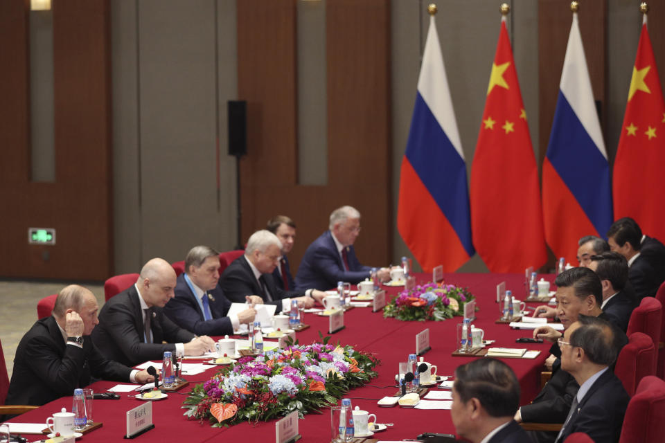 Russian President Vladimir Putin, left, and Chinese President Xi Jinping, third from bottom right, attend the meeting in Beijing Friday, April 26, 2019. (Kenzaburo Fukuhara/Pool Photo via AP)