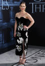 <p>Donning a black velvet dress, complete with sweetheart neckline and lily print, Emilia oozed Hollywood glamour. <i>[Photo: Rex]</i><br></p>