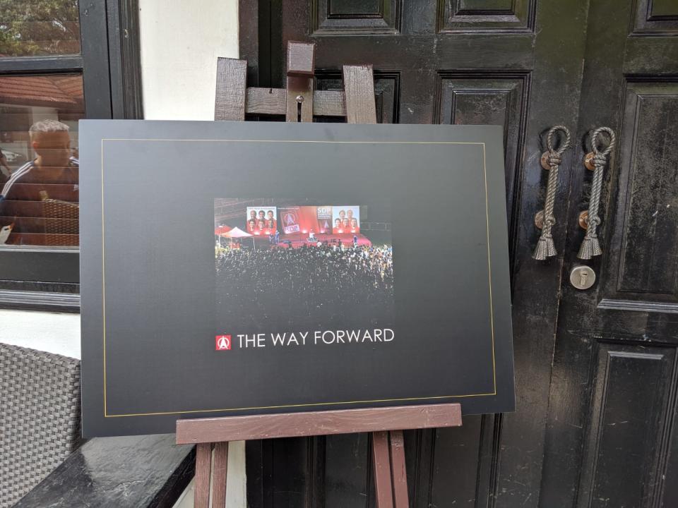 A placard with the design of SDP's coffee-table book 'The Way Forward'. (PHOTO: Wong Casandra/Yahoo News Singapore)