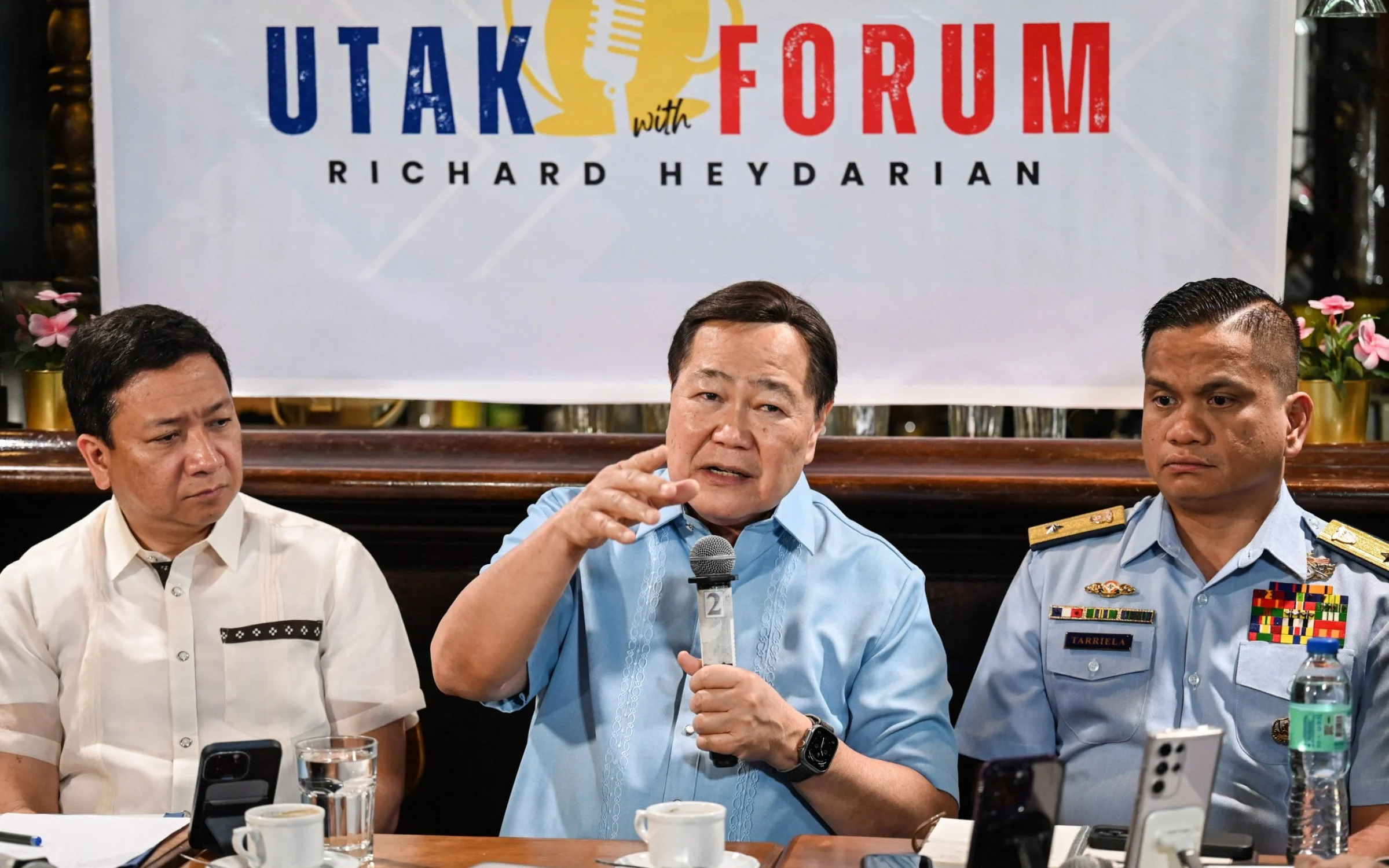 Jonathan Malaya (left), the Philippines national security council assistant director general, Antonio Carpio (centre), a former Supreme Court justice and Jay Tarriela, the Philippine Coast Guard spokesman, talk to reporters about the incident