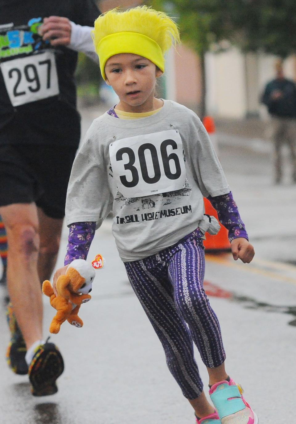 E. Martin, 6, competes Sunday, Sept. 25, 2022, in the Troll Hobble 5K in downtown Alliance. Martin was one of the youngest competitors in the race event.