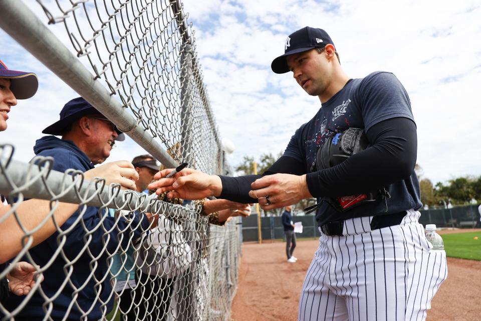 Feb 15, 2024; Tampa, FL, USA; New York Yankees relief pitcher Tommy Kahnle (41) signs autographs during spring training practice at George M. Steinbrenner Field. Mandatory Credit: Kim Klement Neitzel-USA TODAY Sports