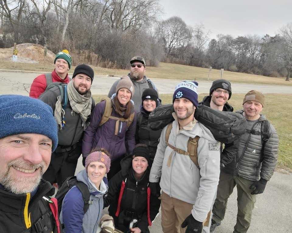 Members of the Good Land Ruck Club, Milwaukee's rucking group, pose for a selfie during a club workout.