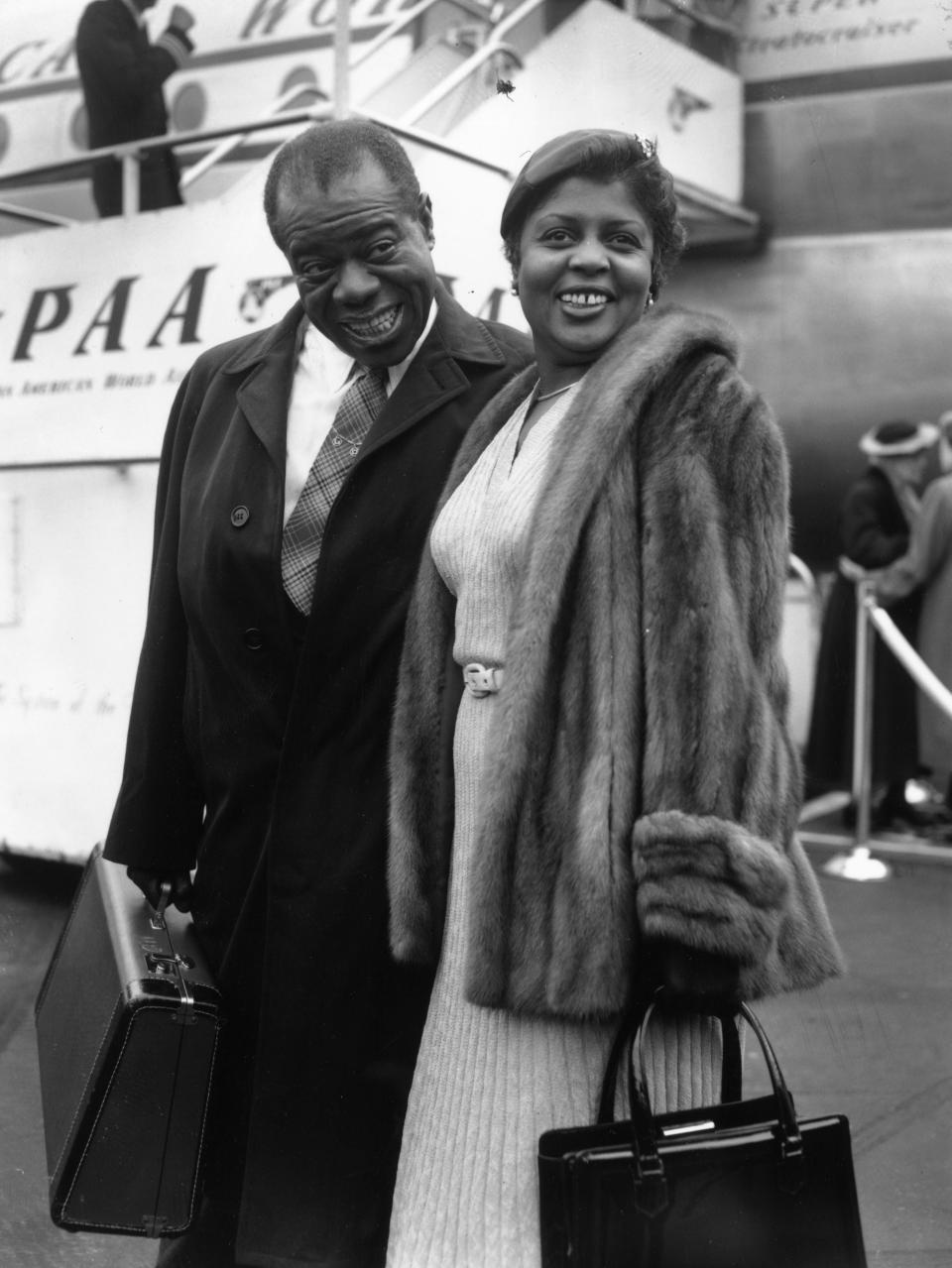 Louis Armstrong with his wife, Lucille, at London Airport in 1956 (Getty Images)