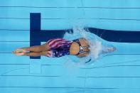 Katie Ledecky, of the United States, starts in the women's 1500-meters freestyle finalat the 2020 Summer Olympics, Wednesday, July 28, 2021, in Tokyo, Japan. (AP Photo/Morry Gash)